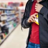 Retail Shoplifting. Man Stealing In Supermarket. Theft At Shop